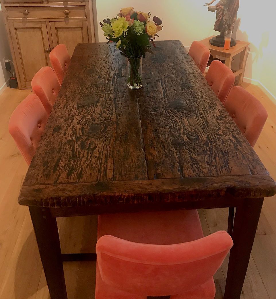 Wooden dining table with 8 pink chairs