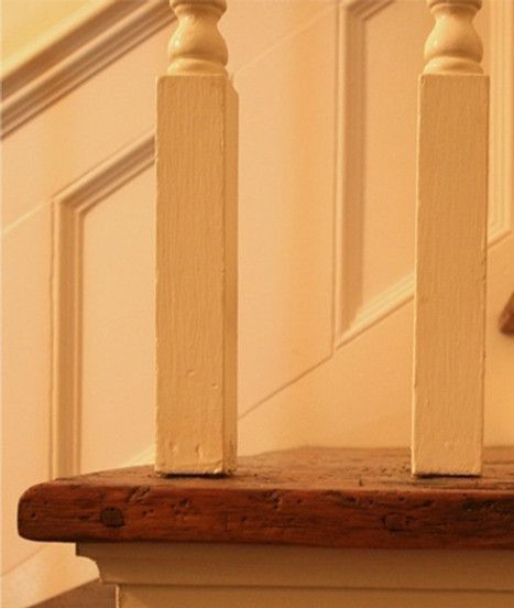 Wooden stair railing with two white posts