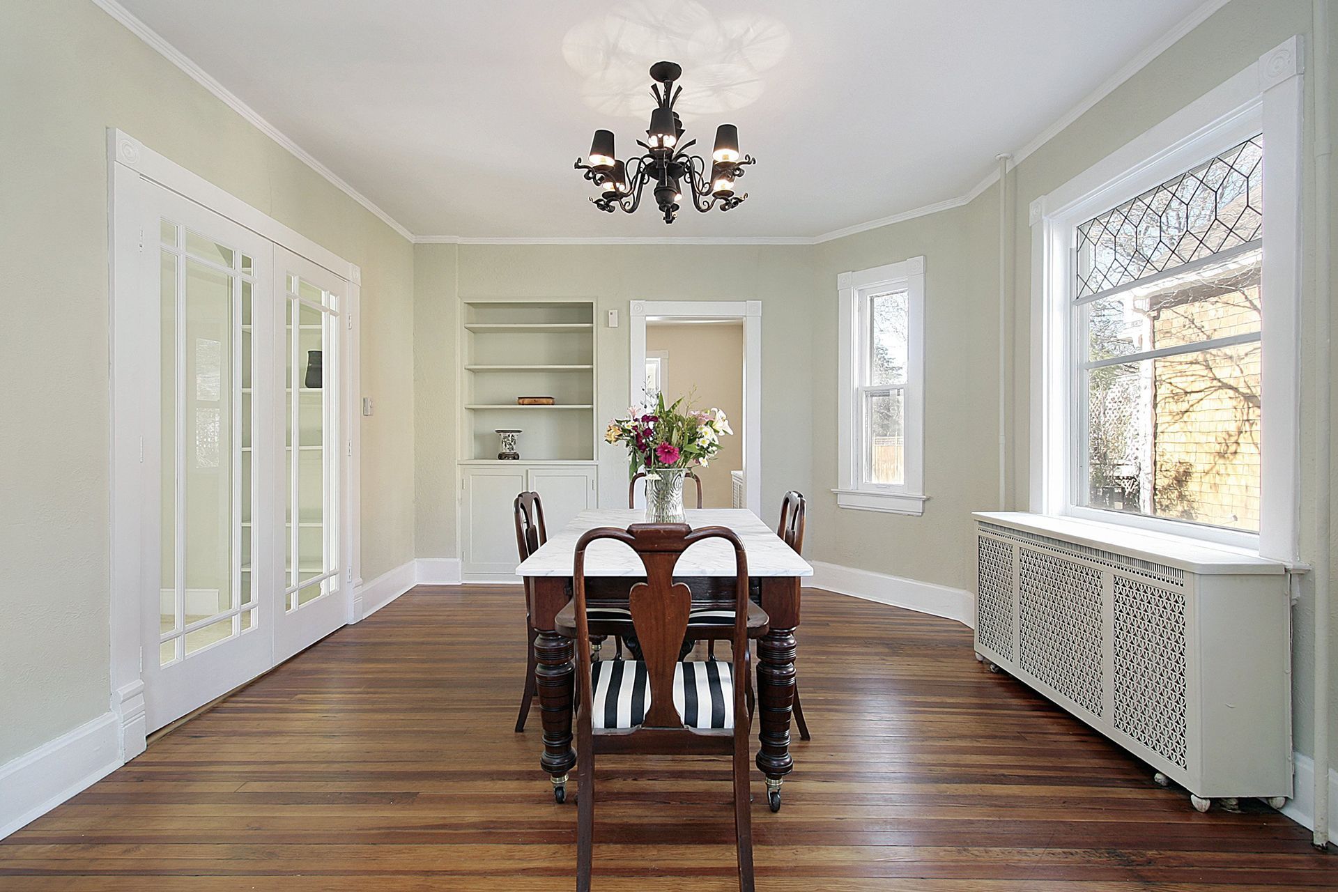 Formal dining room with a table, chairs, and a chandelier