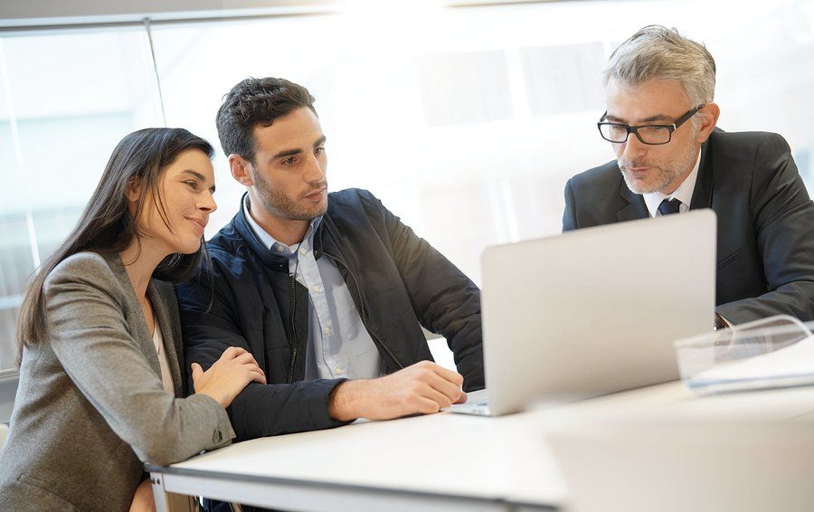 two couples looking at the monitor