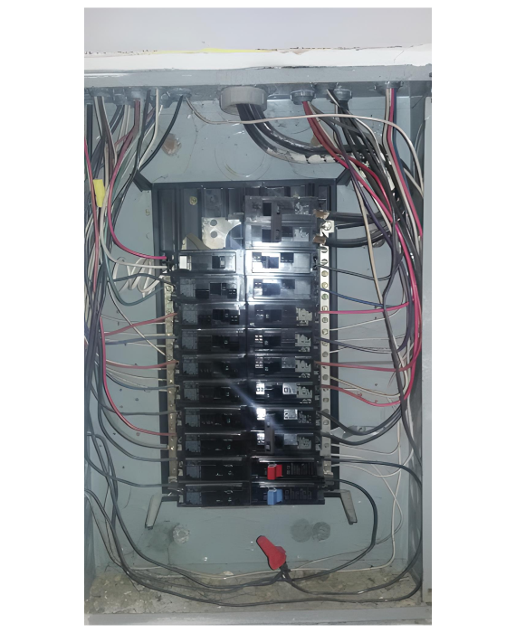 A very messy electrical box with a lot of wires coming out of it.