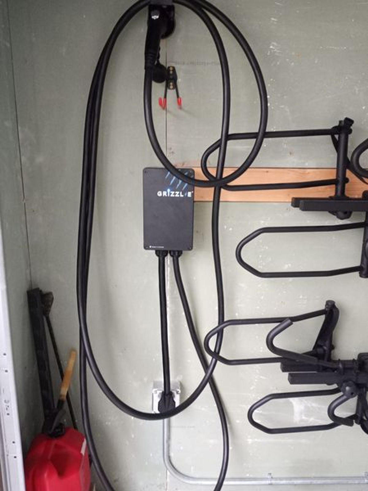 A bunch of wires are hanging from a wall