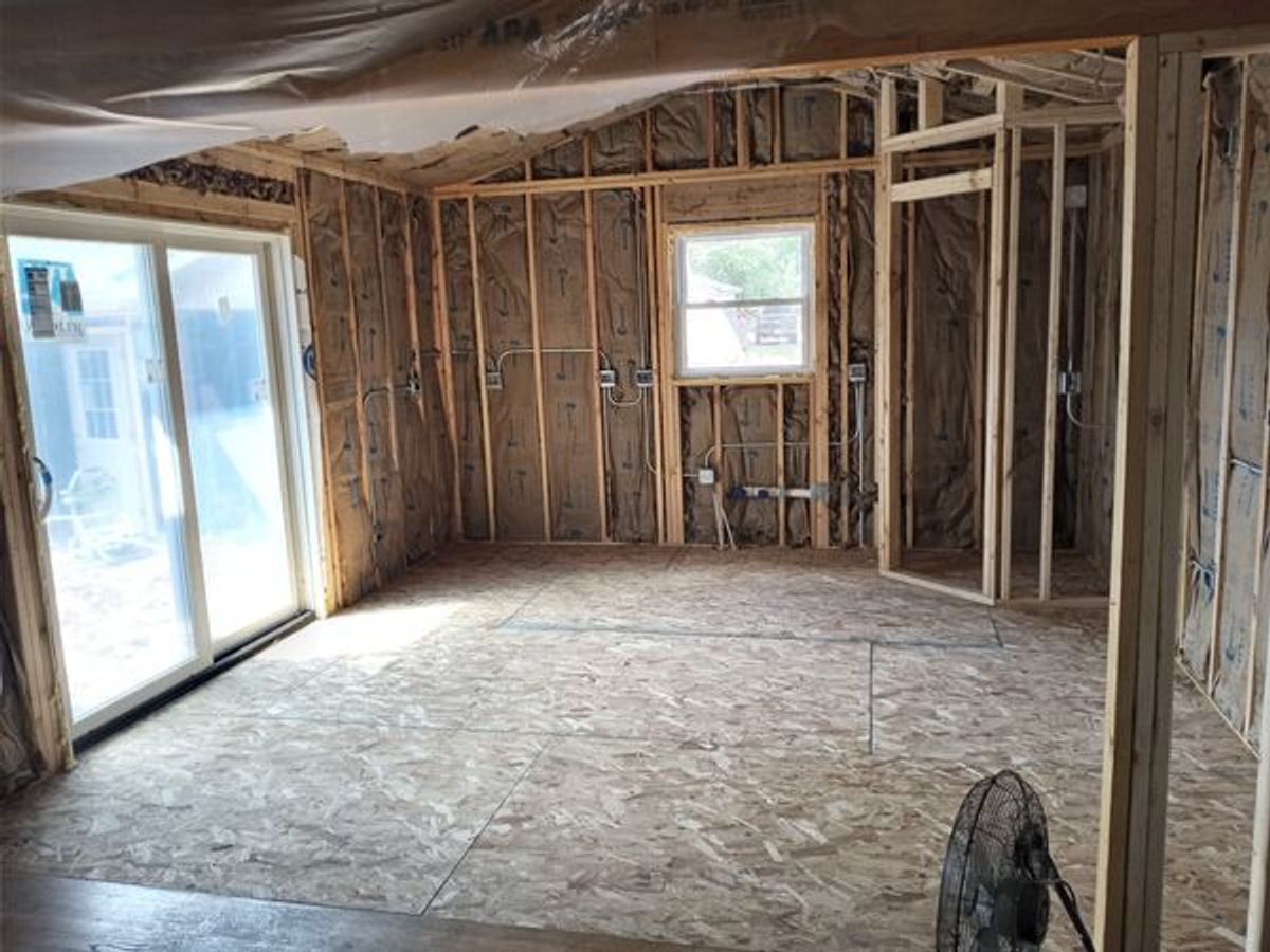 There is a fan in the middle of the room.