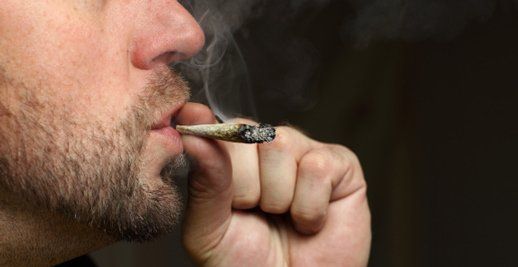 Oral Health — Man Smoking Cigarette in Royal Oak, MI