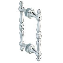 A close up of a chrome door handle on a white background.