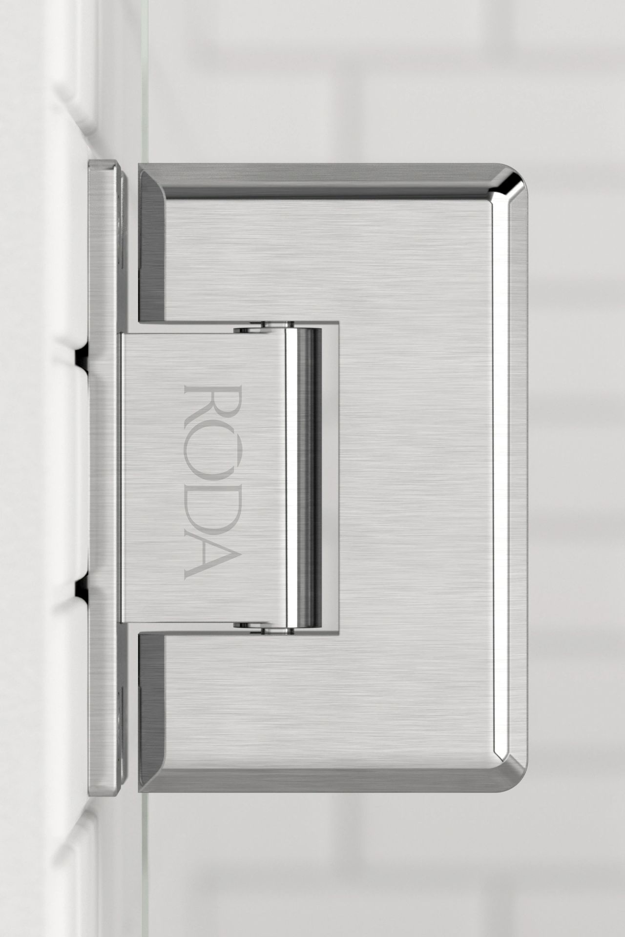 A close up of a stainless steel door hinge on a white wall.