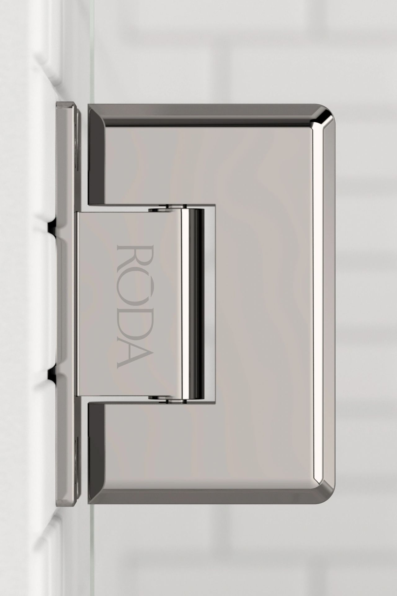 A close up of a door hinge on a white wall.