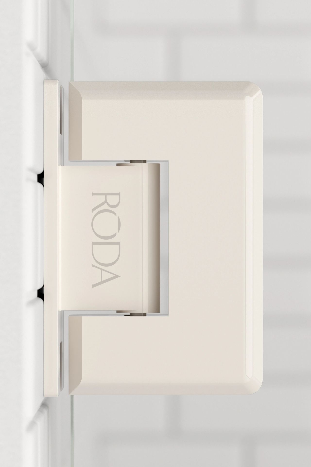 A white door hinge is sitting on a white wall.