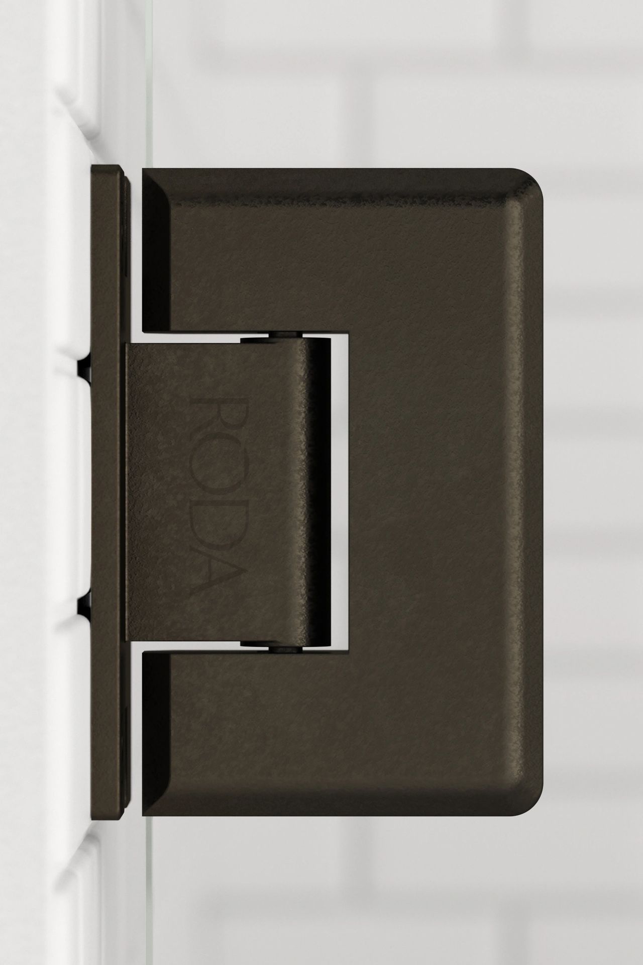 A close up of a door hinge on a white wall