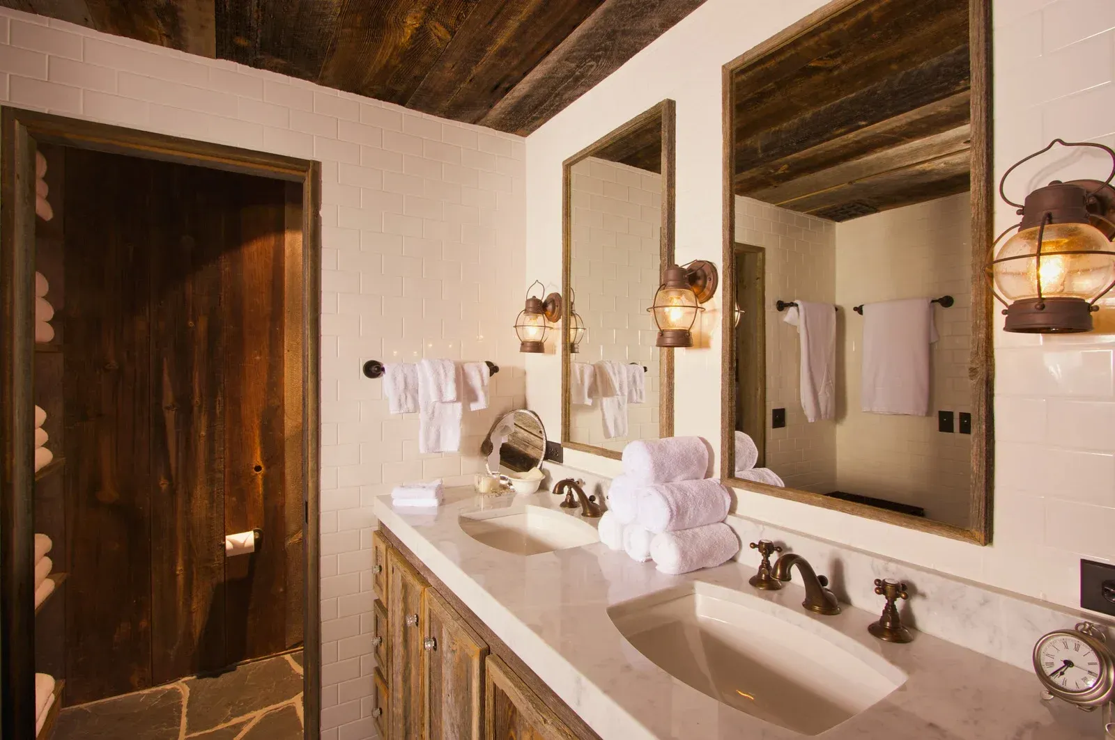 A bathroom with two sinks and two mirrors
