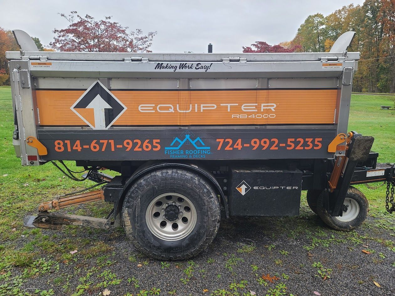 A dumpster is parked in a grassy field.