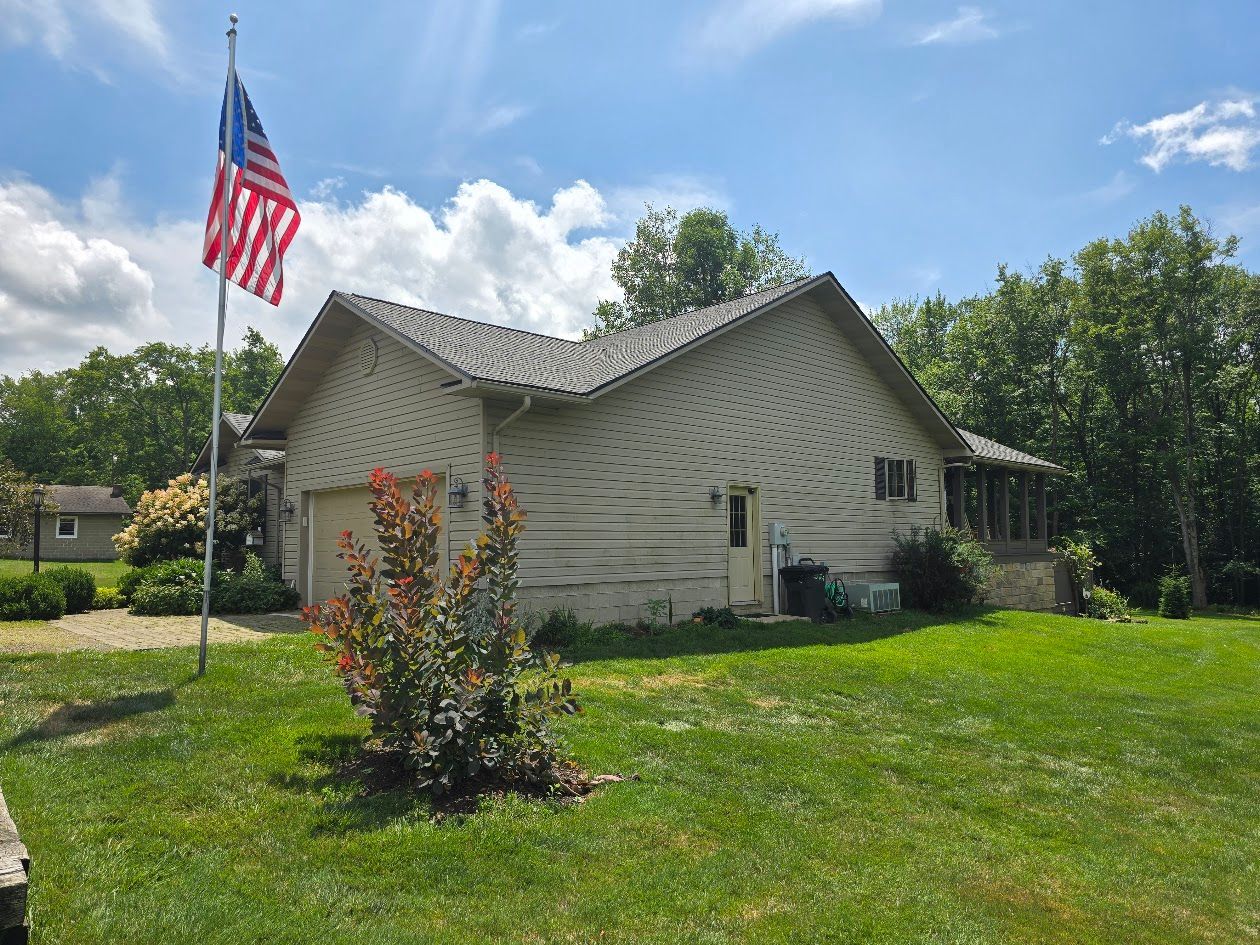 A house with an american flag flying in front of it.