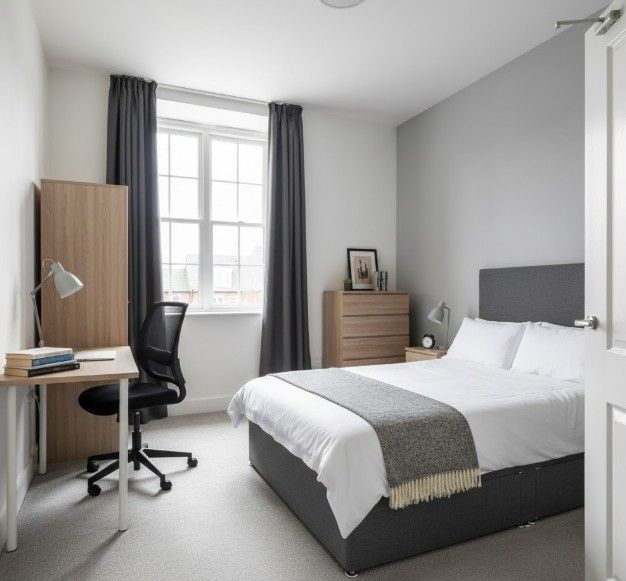 Compliant HMO double bedroom showing adequate room size, appropriate furnishing and professional tenant-ready presentation