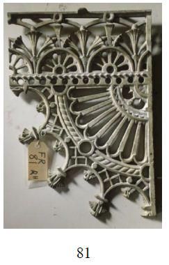 A picture of a wrought iron shelf bracket with a tag attached to it.