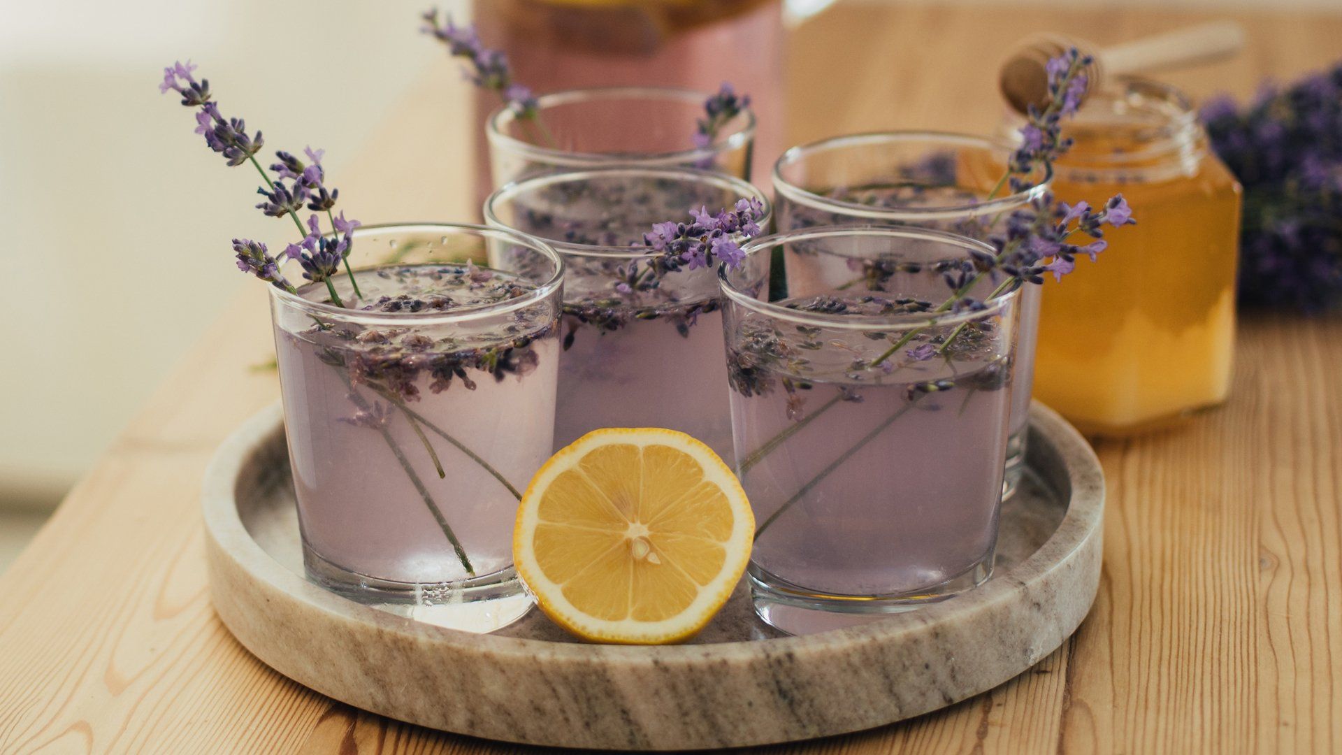 Lavender Honey Lemonade in five glasses