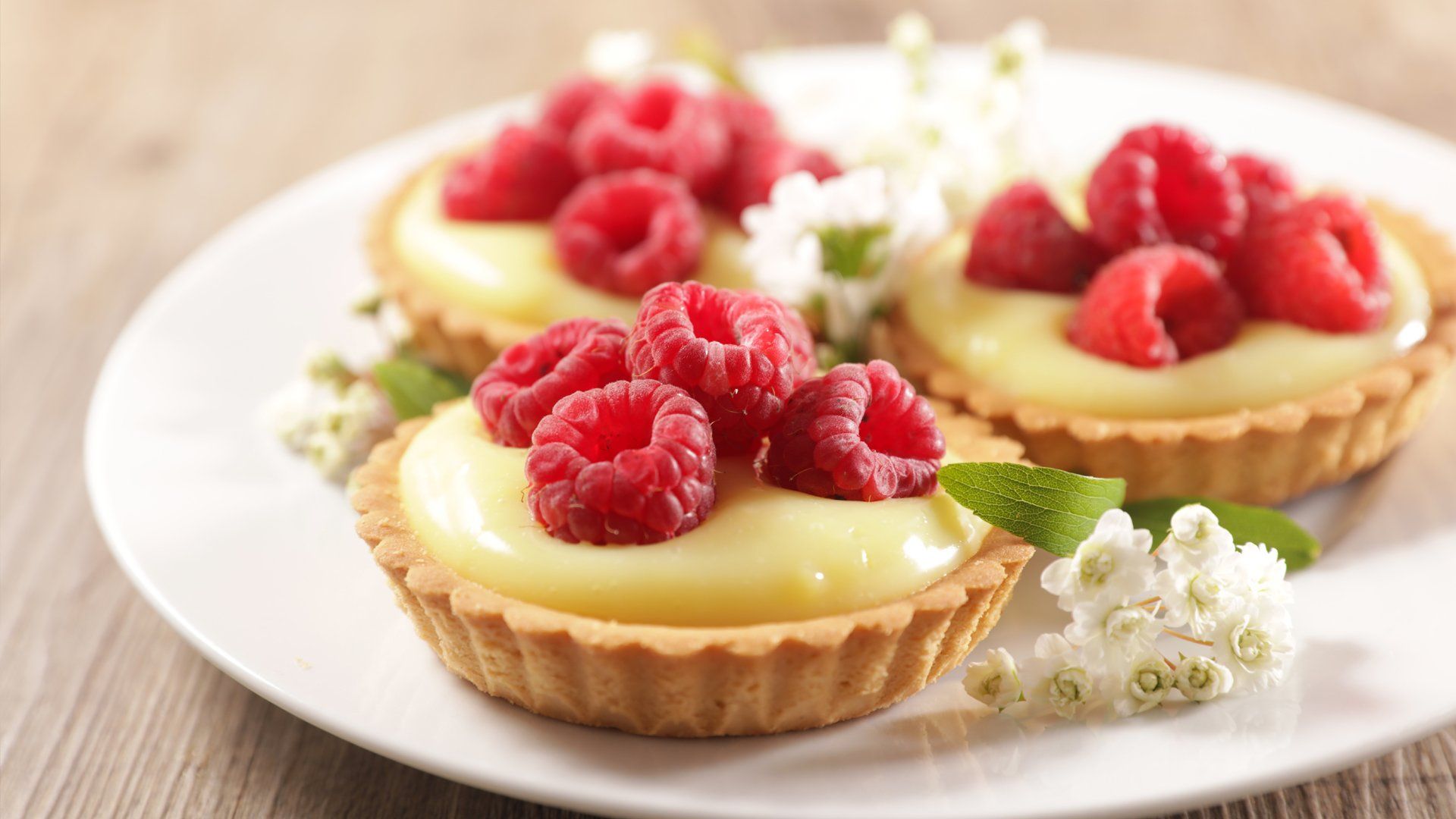 Easy Honey Lemon Tart on a plate with berries