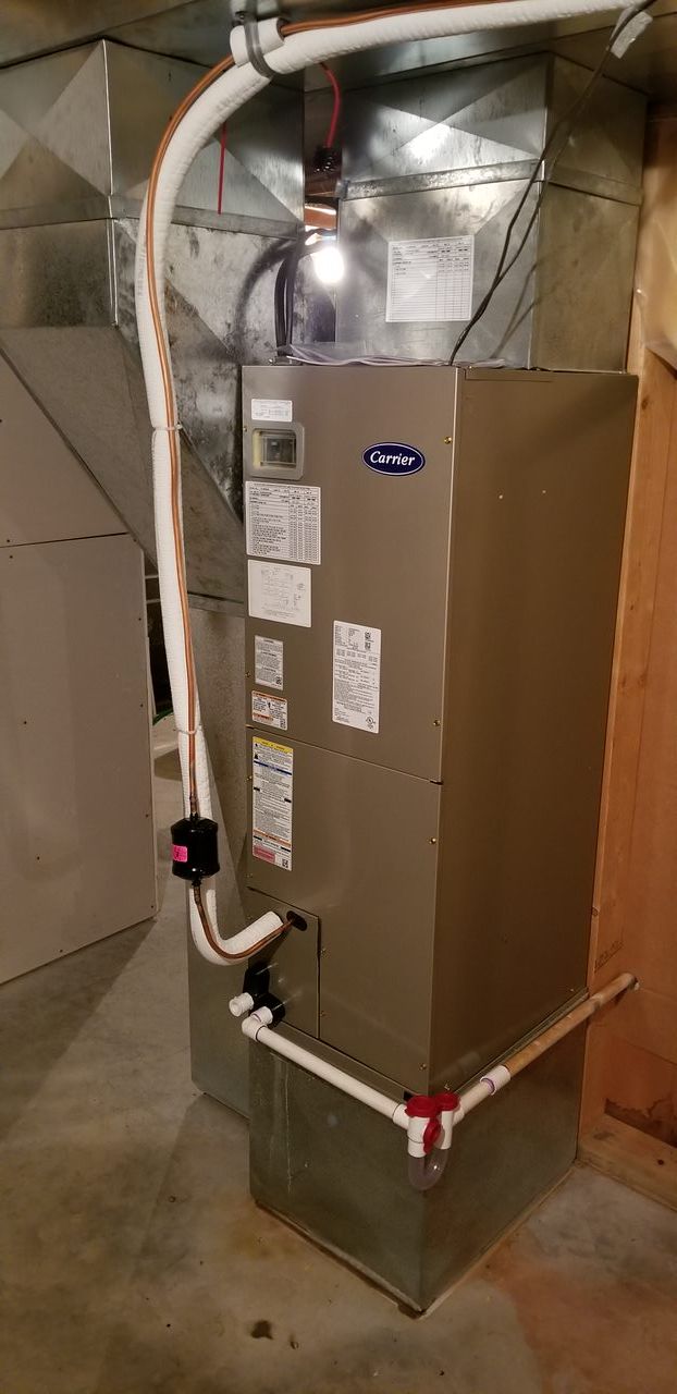 A heating and cooling system is installed in a basement.
