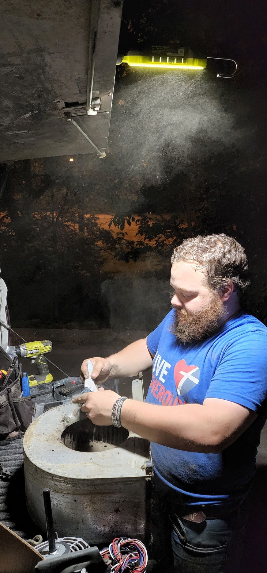 A man in a blue shirt with the word texas on it