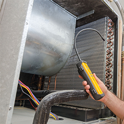 A person is holding a tool that says ' a ' on it