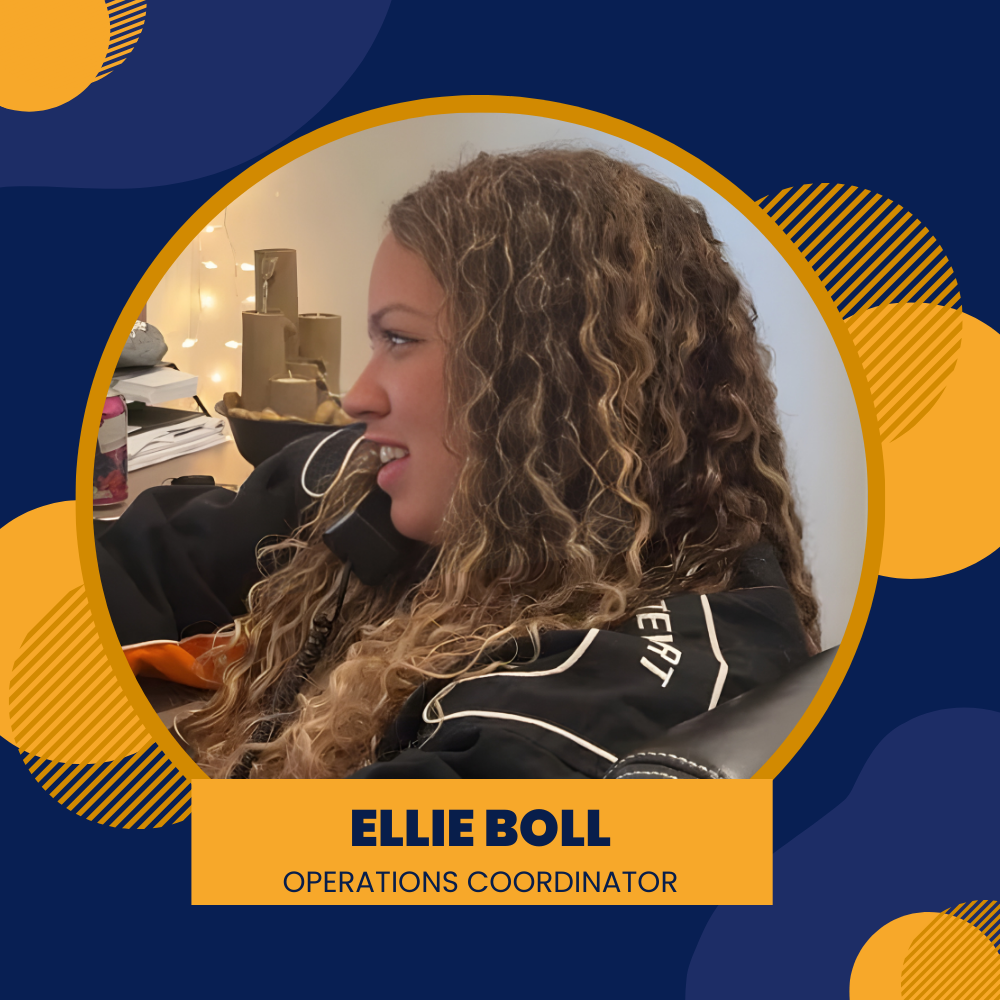 Woman with curly hair, in a black top, smiling in a circular photo frame. 