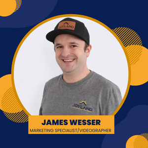 Joyland Roofing logo with blue and orange accents. White circle with roof graphic, company name, and James Wesser title.