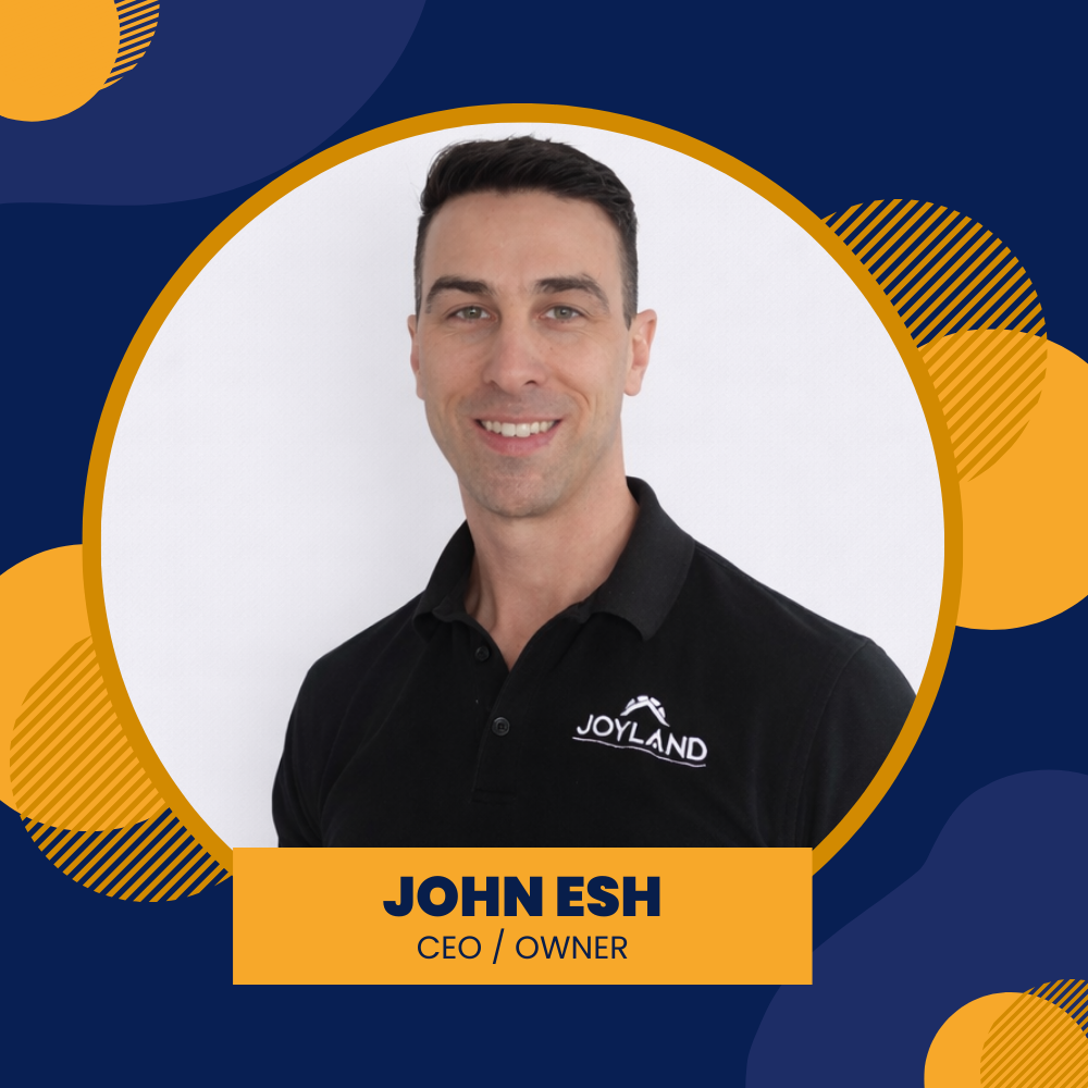 John Esh, Owner/CEO, smiling, wearing a dark polo shirt, against a blue and gold background.