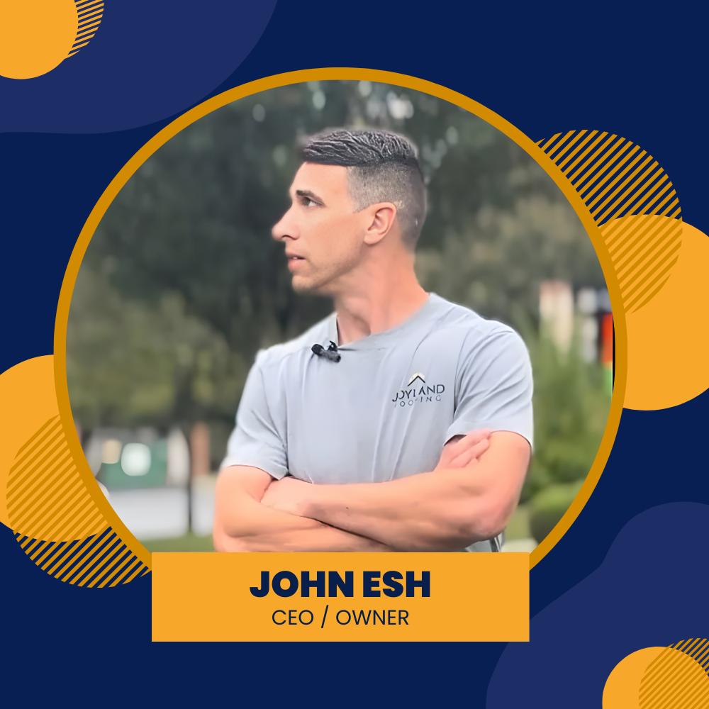 John Esh, CEO/Owner, arms crossed, looking left. Gray t-shirt, outdoor setting, framed in gold and blue.