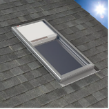Skylight in a gray shingle roof; the window is open and showing the interior shade.