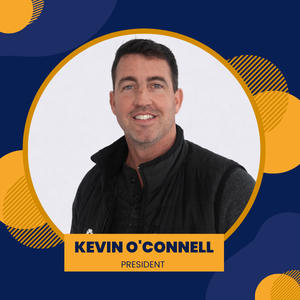 Kevin O'Connell, smiling, in a gray polo shirt, against a gradient background with yellow and blue shapes. 