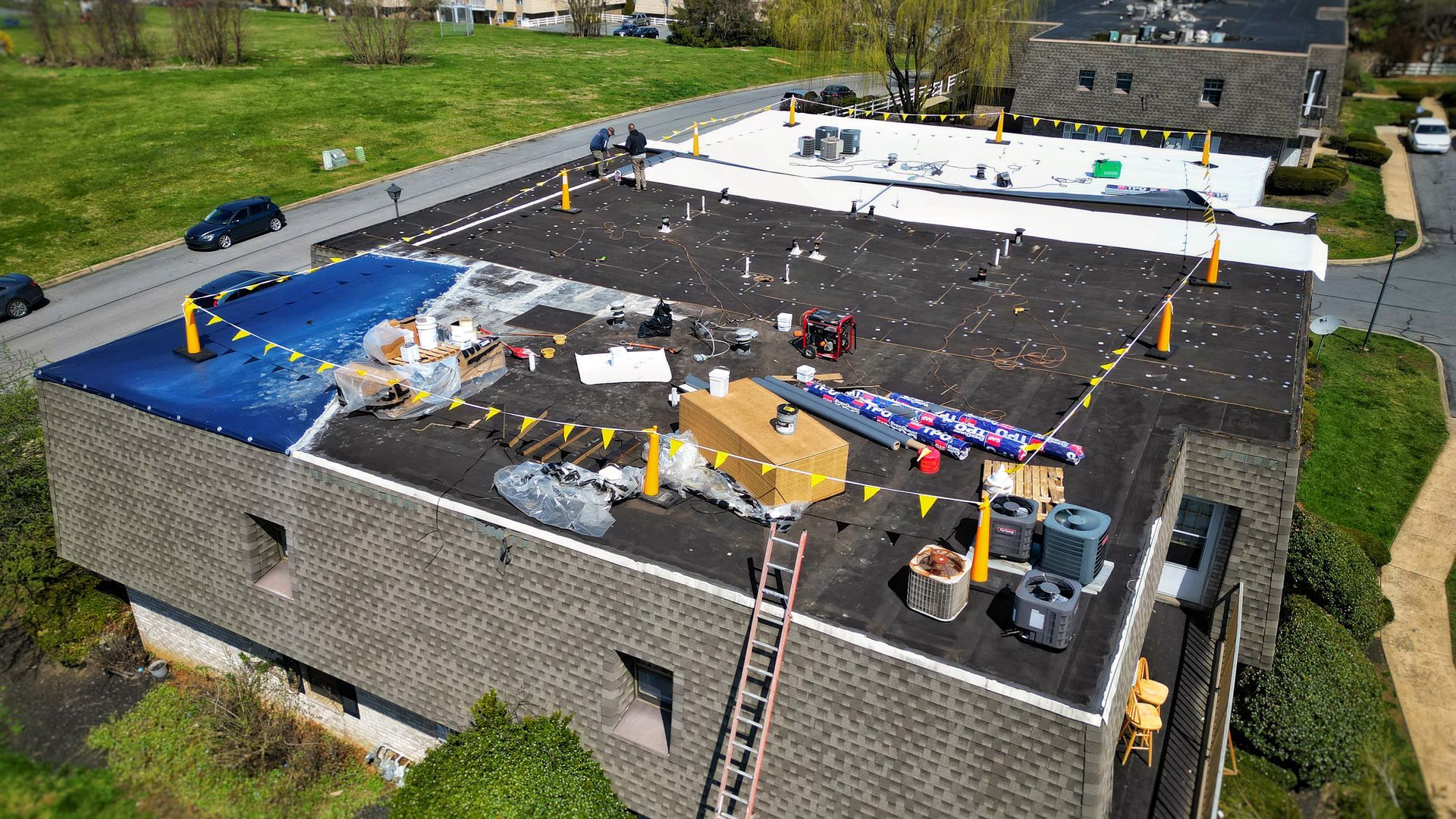 Wooden shingle roof (left) and gray slate tile roof (right) close-up, showing different textures.