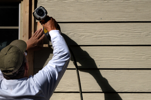 Damaged asphalt shingle roof with missing and torn shingles.