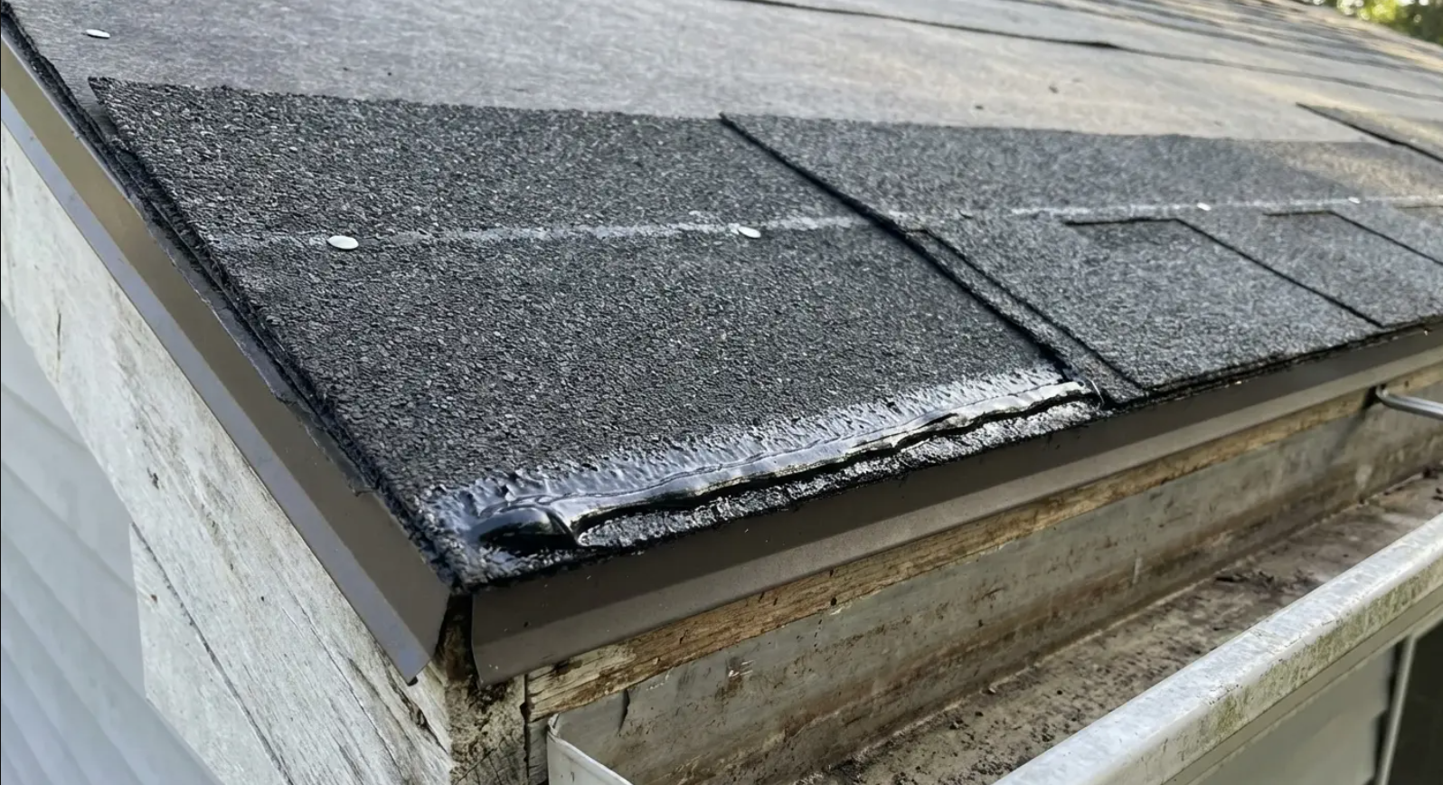 Starter shingles installed along the roof edge to secure the first row and prevent wind lift.