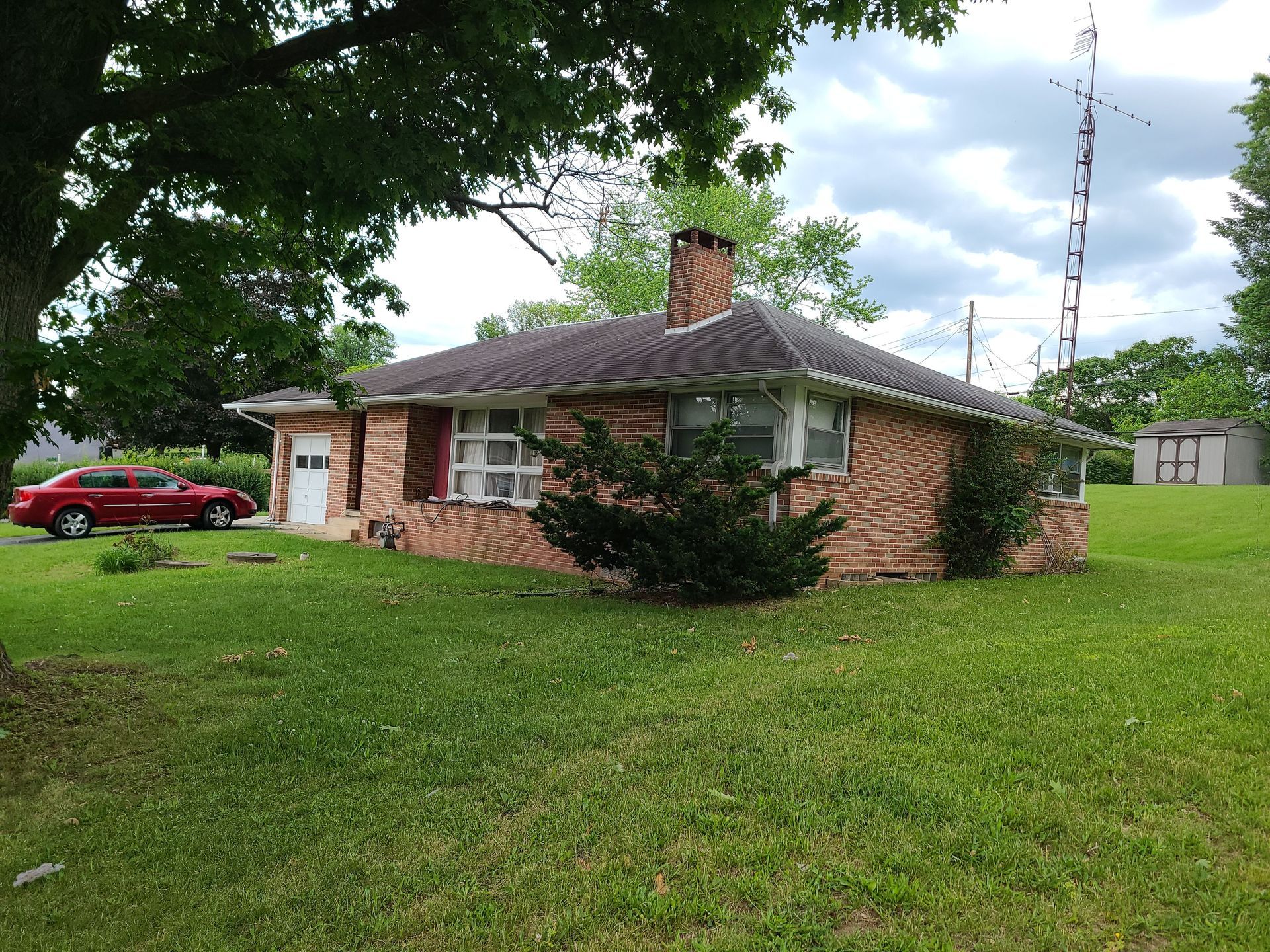 Single-story brick home in York, PA featuring a residential roofing project completed by Joyland Roofing.