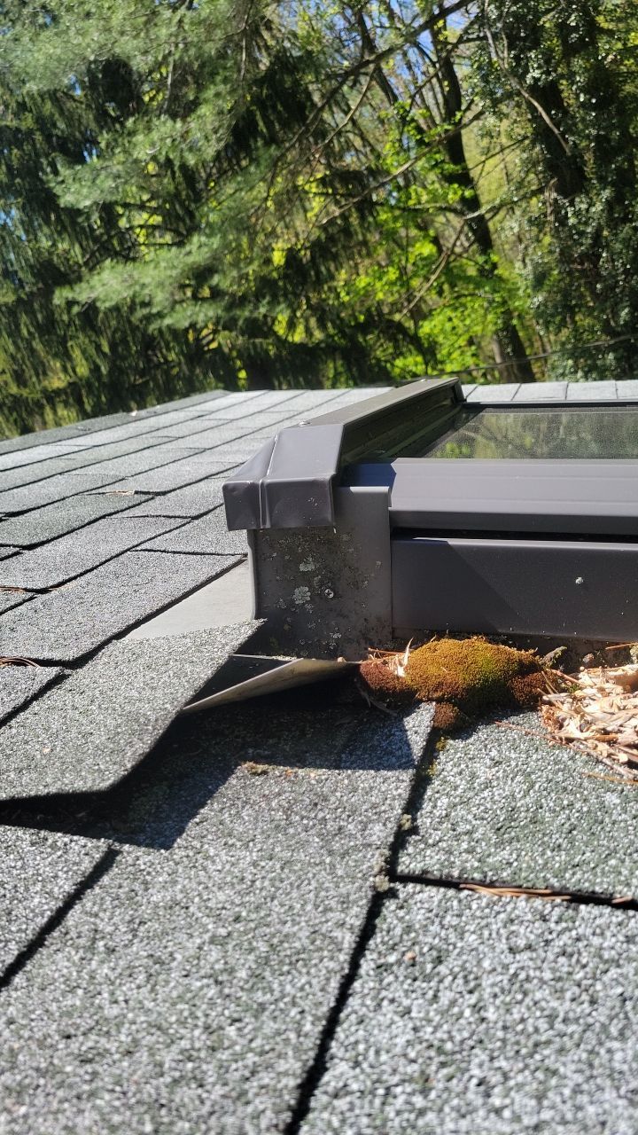 Close-up of skylight flashing inspected on an architectural shingle roof in Penryn Lane, Cornwall, PA.