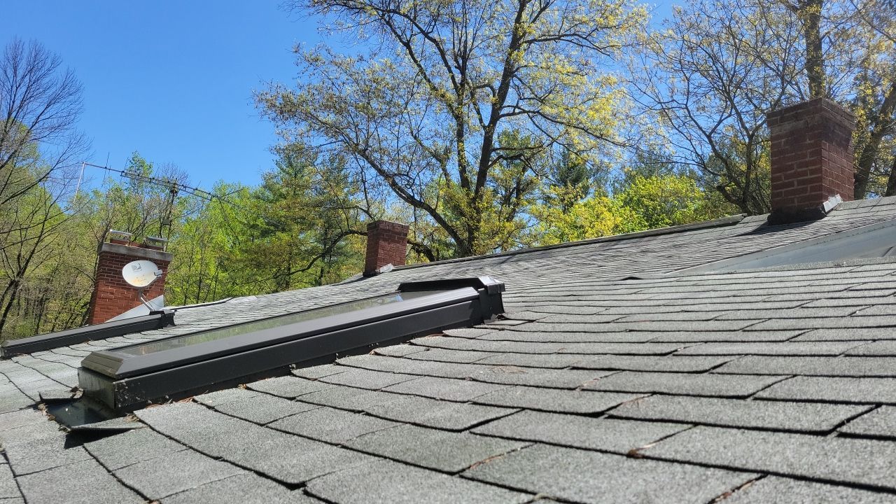 New asphalt shingle roof with skylight installation on Penryn Lane in Cornwall, PA.