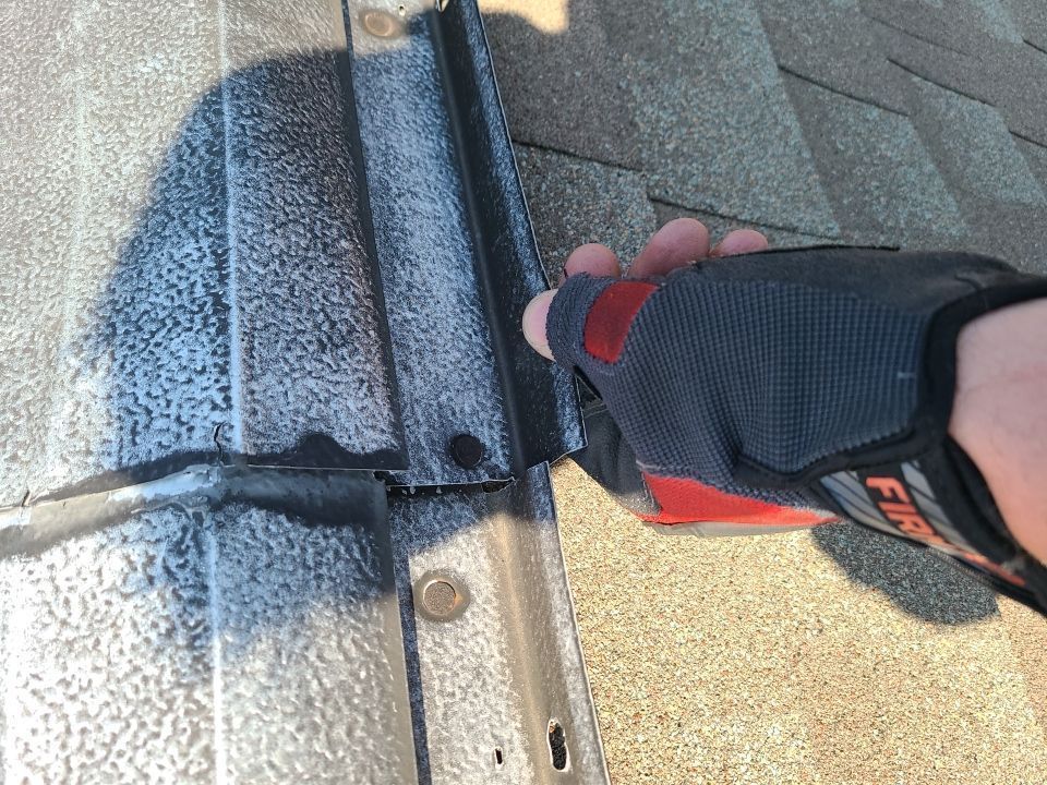 Close-up of metal roof flashing replacement on an asphalt shingle roof in South Mountain Lane, Cornwall, PA.