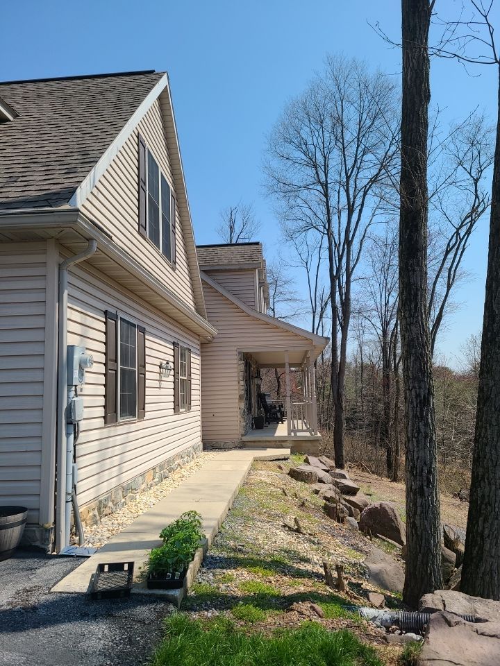Home with a completed architectural shingle roof replacement on South Mountain Lane in Cornwall, PA.