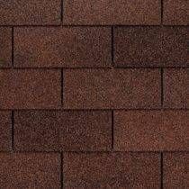 Dark brown asphalt roof shingles.