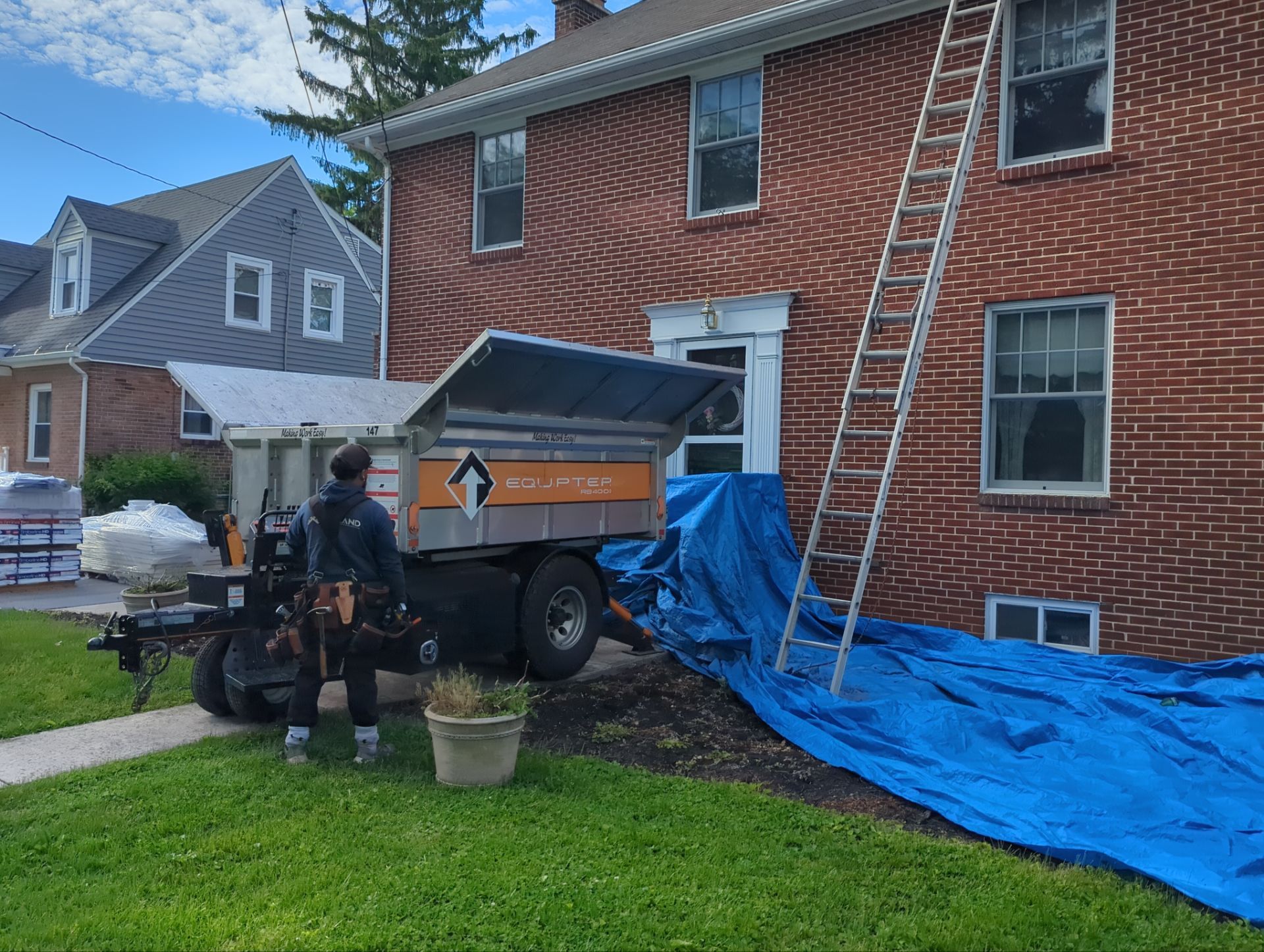 Joyland Roofing crew preparing a residential roofing project in York, PA with professional equipment, protective tarps, and on-site safety setup.