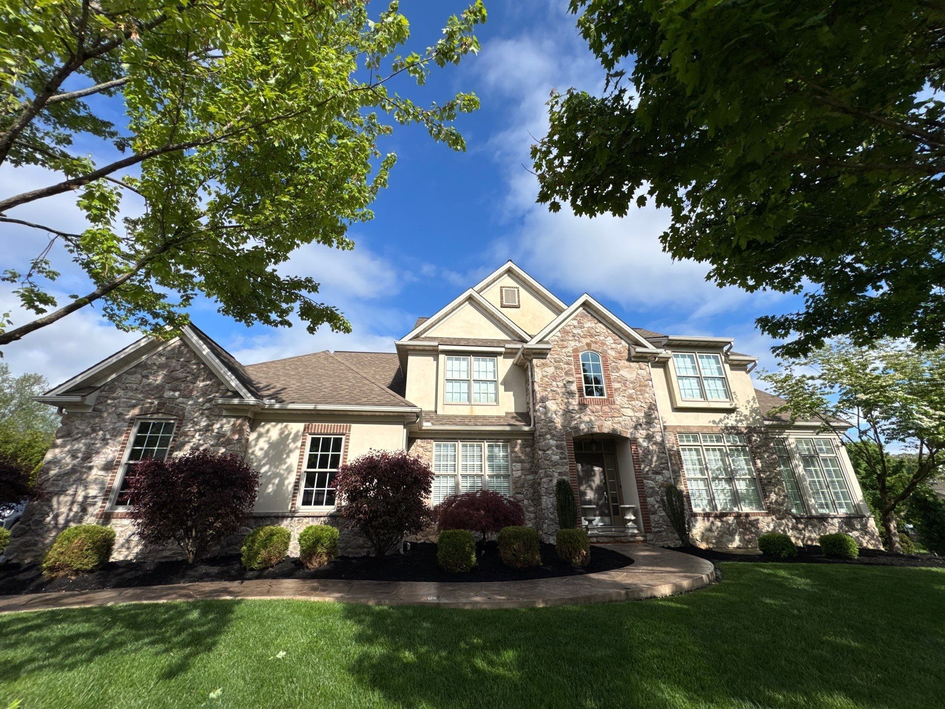 Luxury residential home in York, PA featuring a professionally installed asphalt shingle roofing system completed by Joyland Roofing.