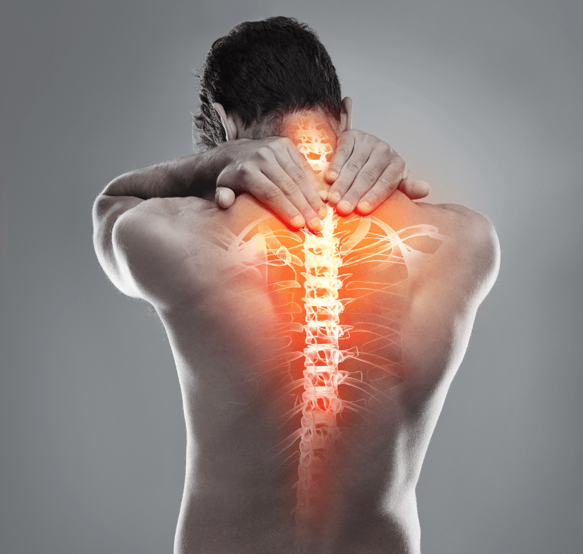 A man is holding his neck and back in pain.