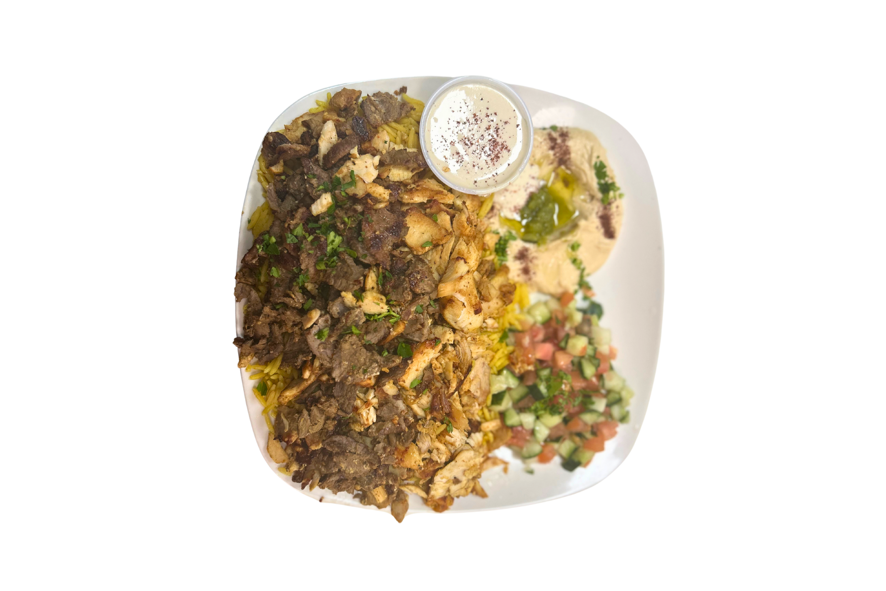 A plate of food with a dipping sauce on a white background.