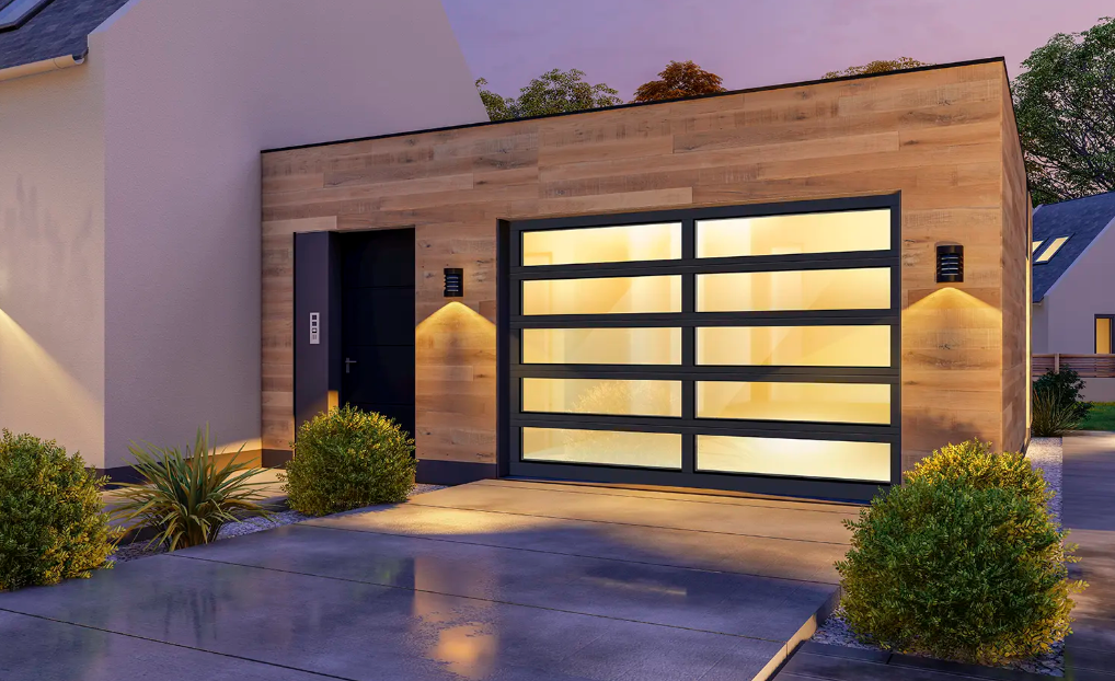 Sleek all glass garage door with clear glass design and black aluminum frame on a modern house in Bradenton, FL