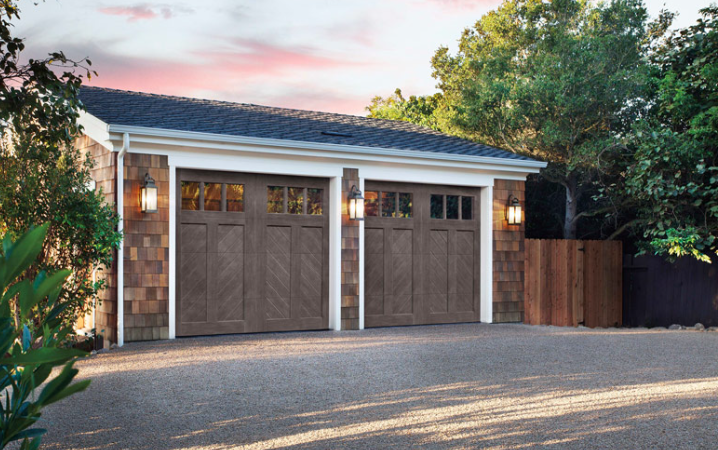 Garage door with chevron cladding and wood-like finish