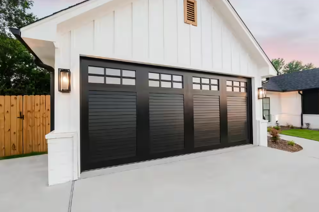 Stylish garage door featuring wood appearance and cladding overlay in Bradenton, FL