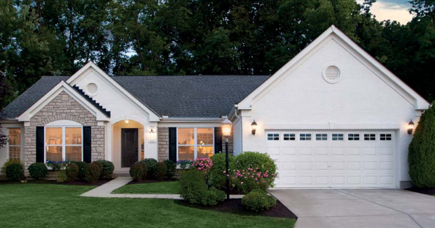Two car steel garage door in color white with traditional square design and window section in Bradenton, FL
