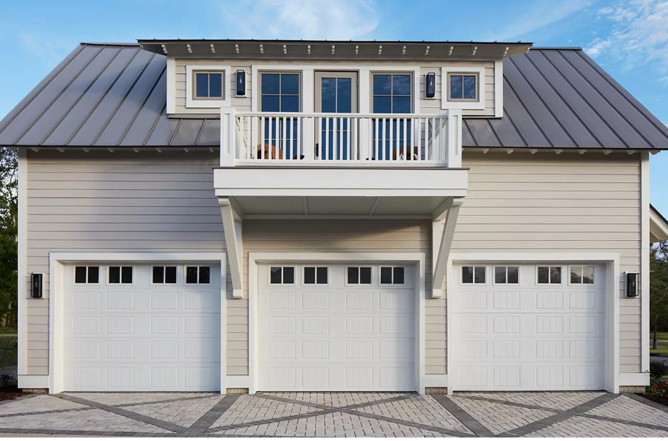 Single car garage doors with window top sections and lines going down each square on the exterior with white color in Venice