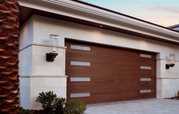 Shop two car wood garage doors with modern window sections going down sides in Venice, FL