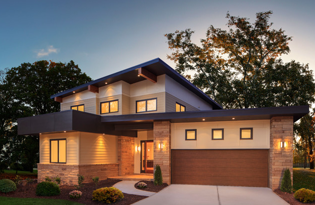 Flush and smooth finish steel garage door with wood look paint on new construction house in Bradenton, FL