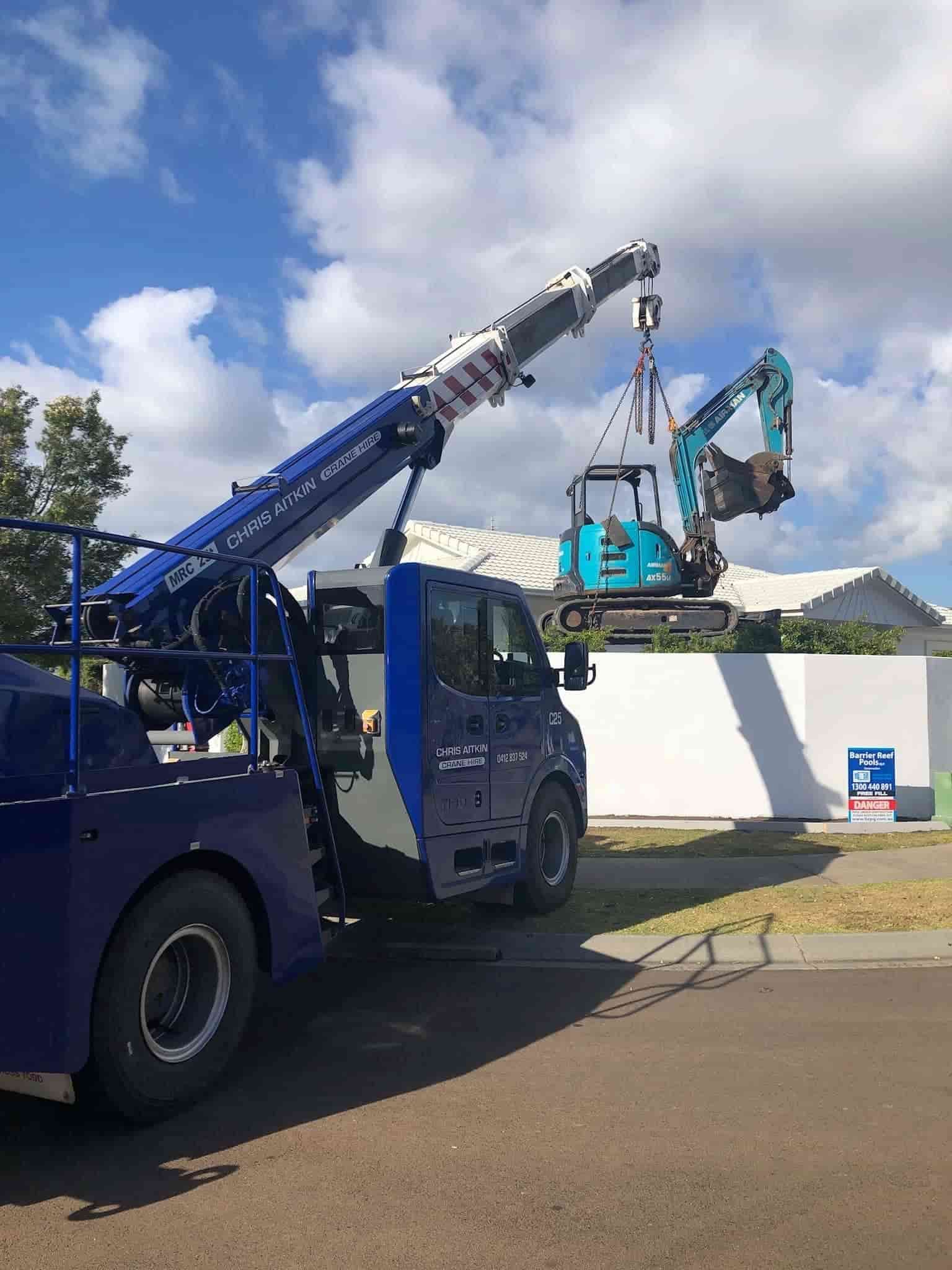 A Blue Truck Is Being Lifted By A Crane — CA Crane Hire in Forest Glen, QLD